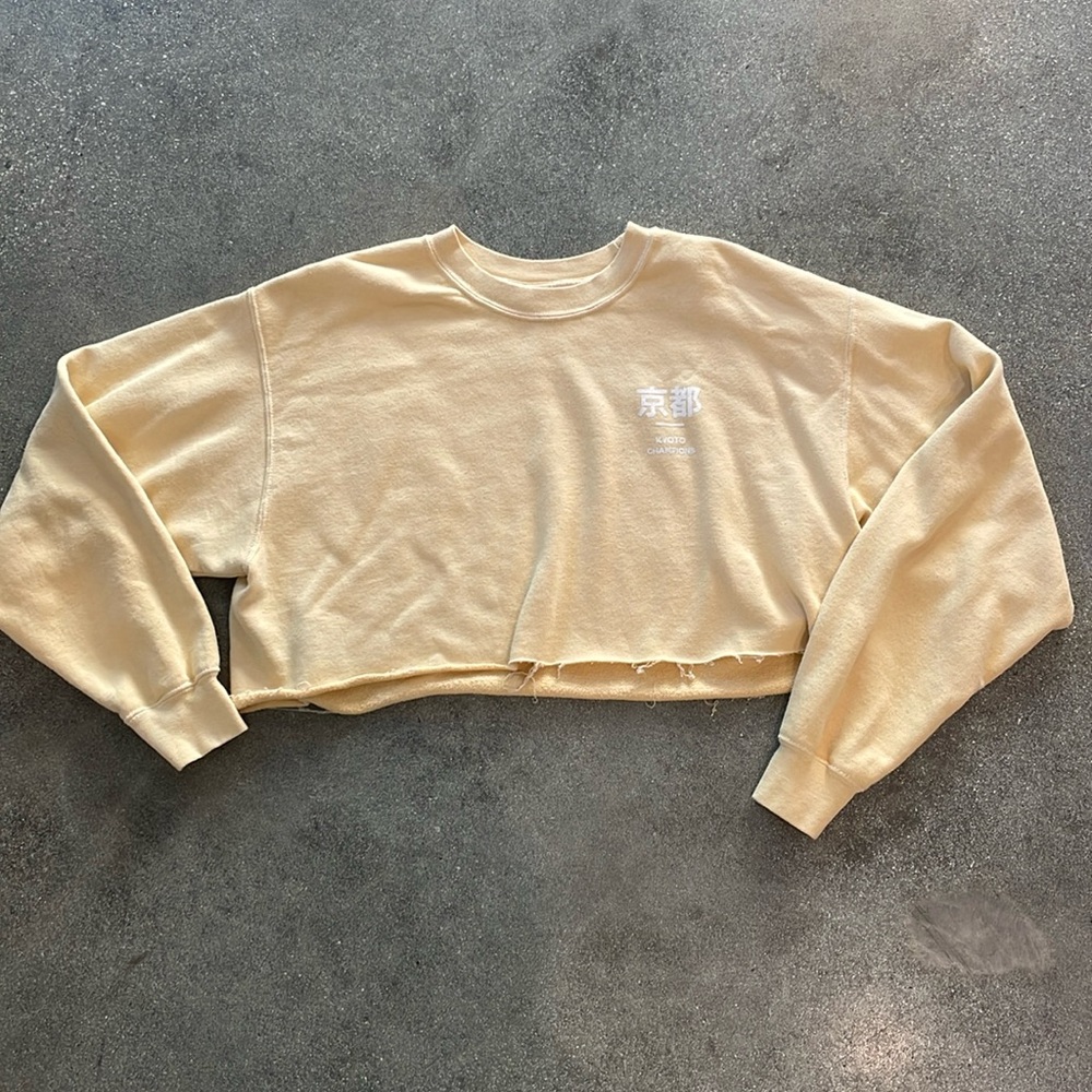 Urban Outfitters cropped graphic sweatshirt. Pale yellow. Kyoto Champions